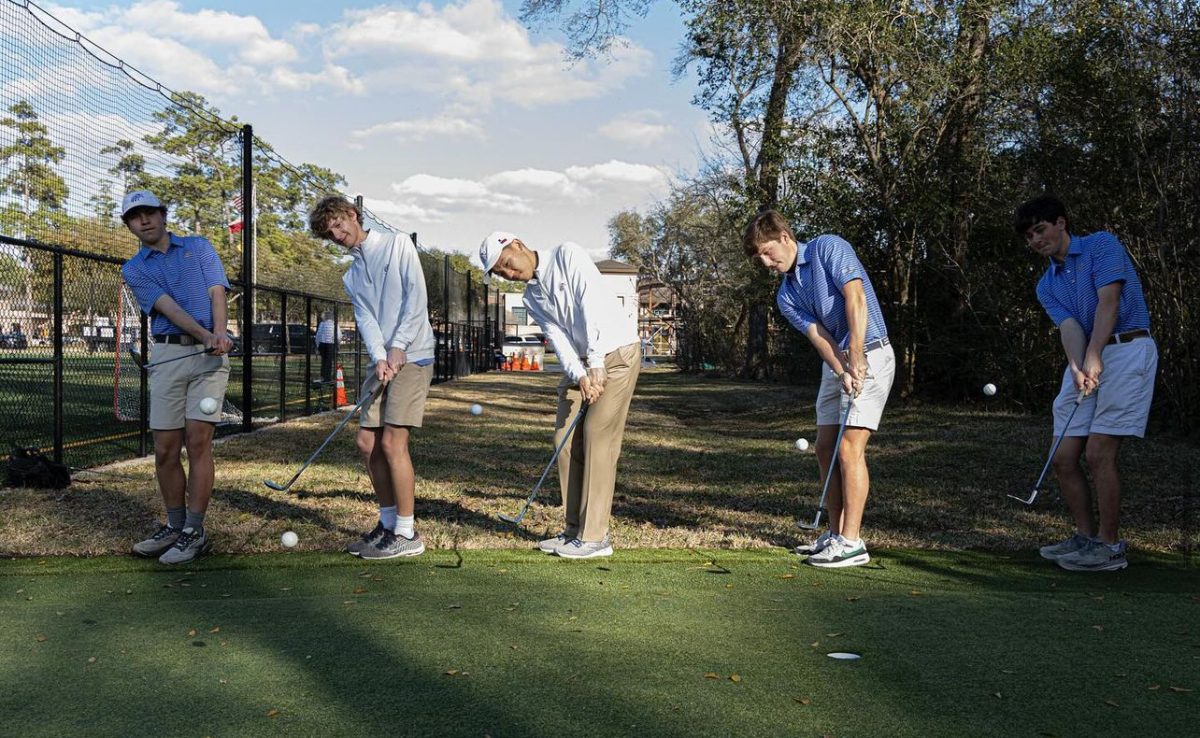 Golfers teed up at the dedication of the new putting green.